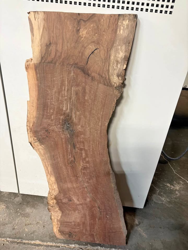 Walnut slab in the shape of the state of California.