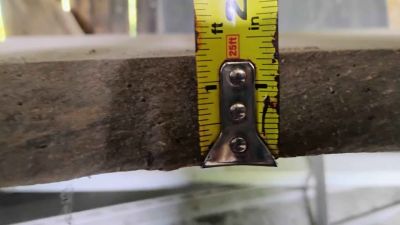 Two large wood slabs, wooden blocks,short wooden poles, large wooden posts